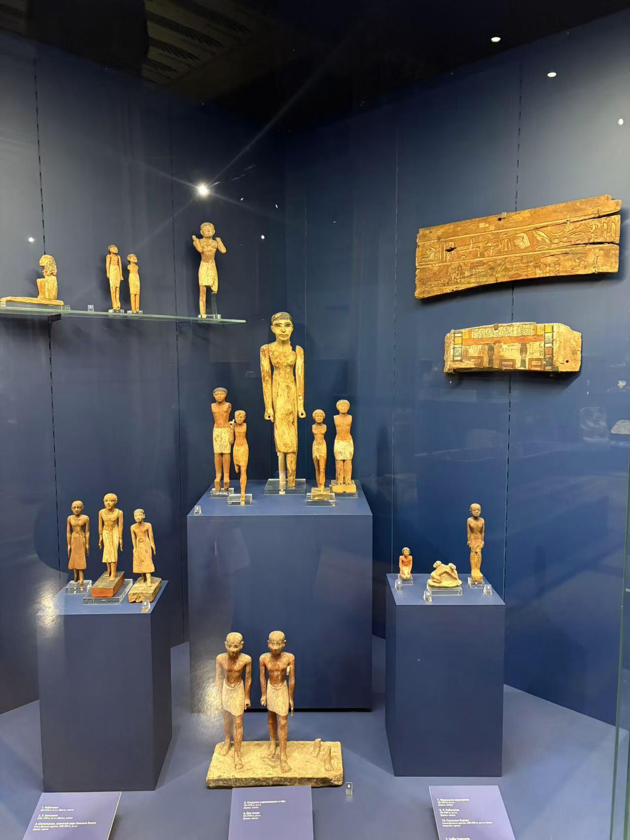 Wooden Statues and Sarcophagus Fragments
