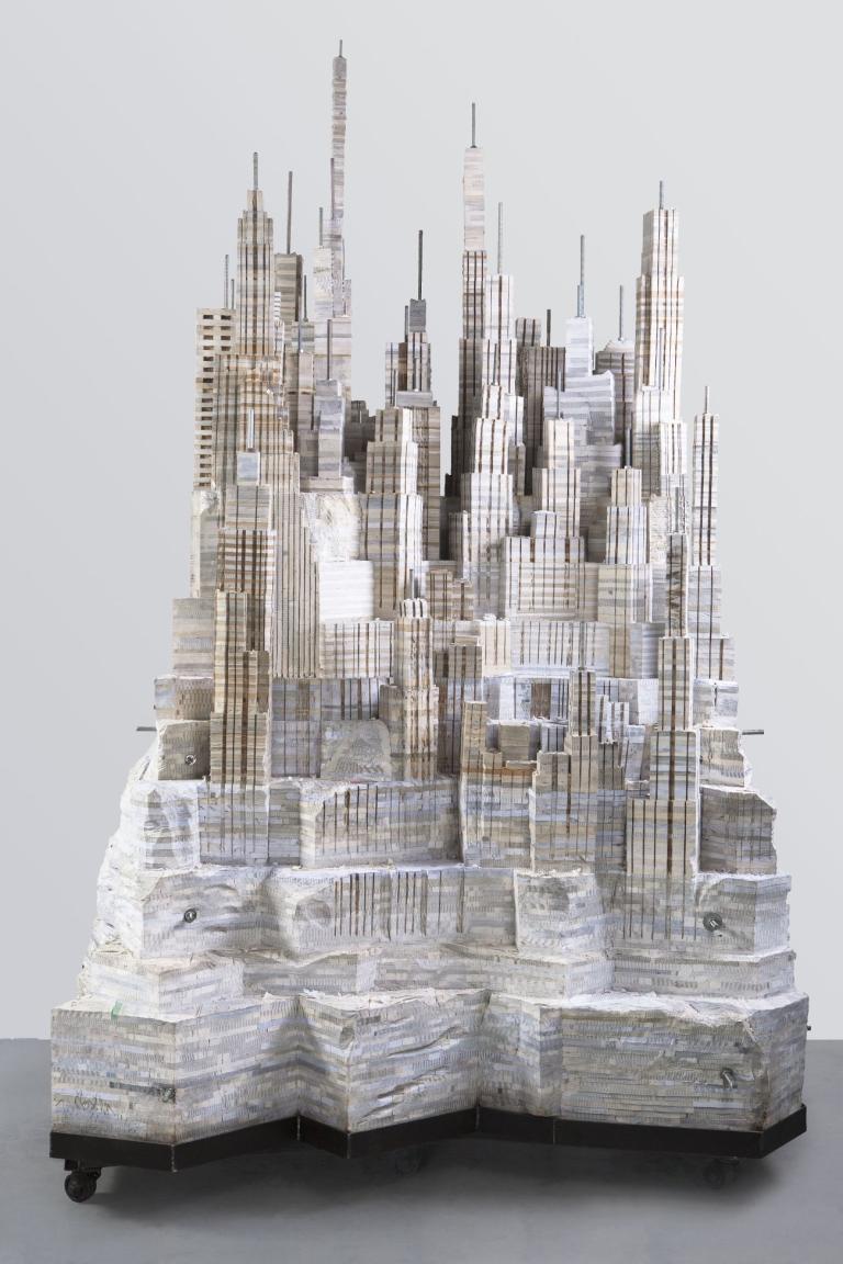 Chaotic Cities Are Made of Stacks Upon Stacks of Recycled Text Books