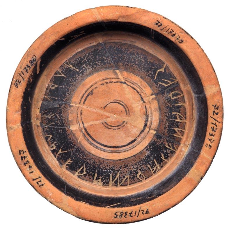 Base of an Attic Black-glazed Bowl with a Dedication Inscription