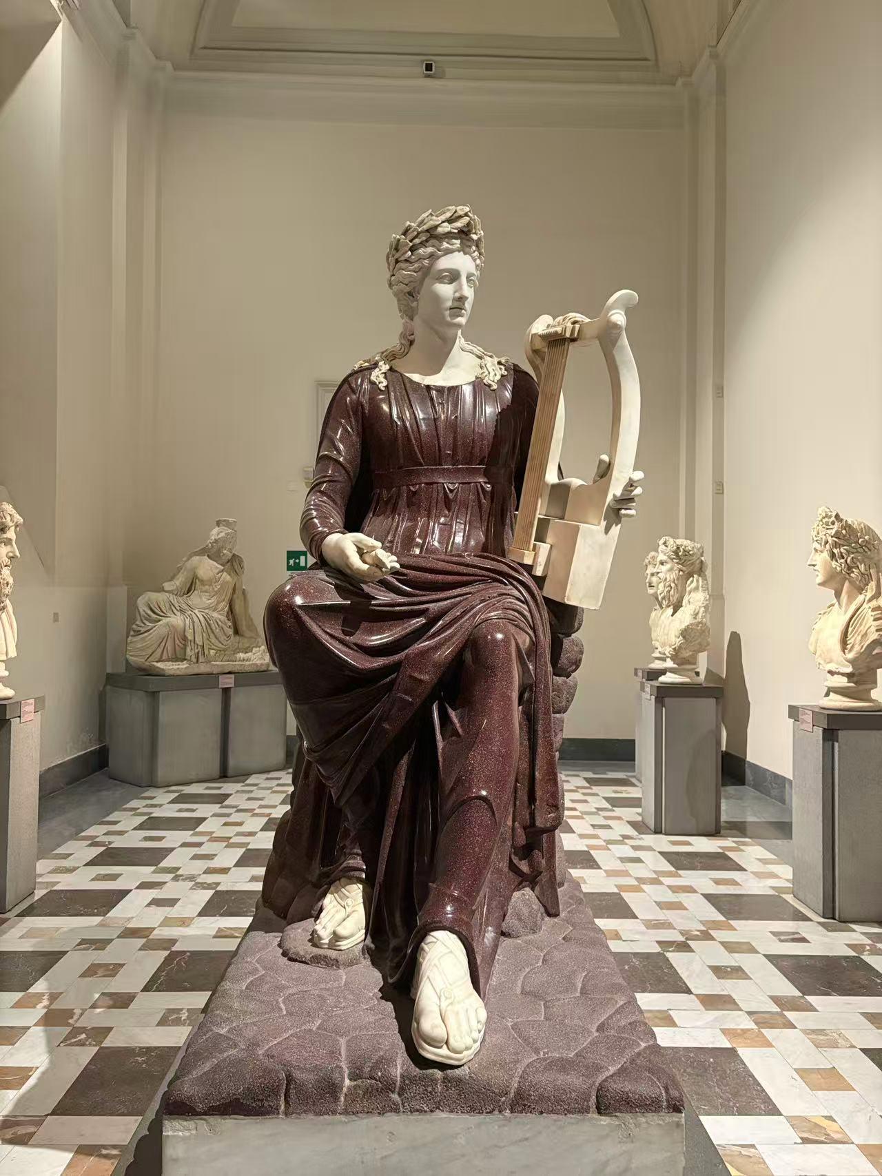 Apollo Playing the Kithara Seated on a Rock